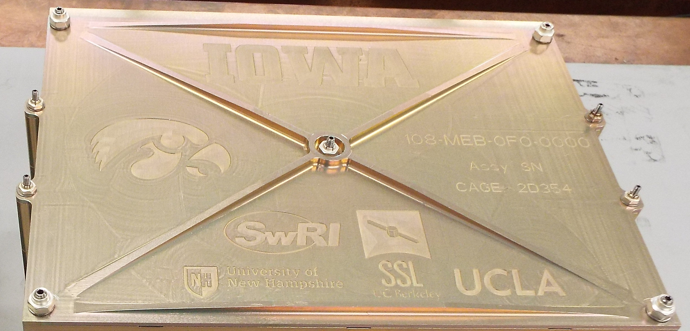 This image shows the participating schools' logos, which are etched into the top surface of the Main Electronics Box (MEB) used on both TRACERS satellites.