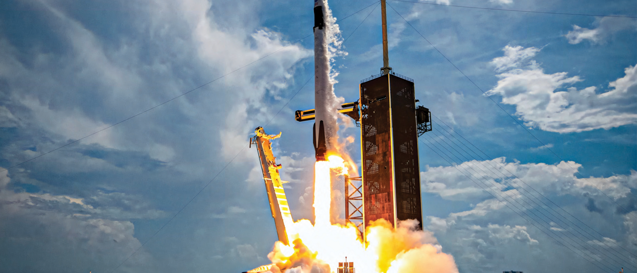 A photo of a SpaceX Falcon 9 rocket as it lifts off