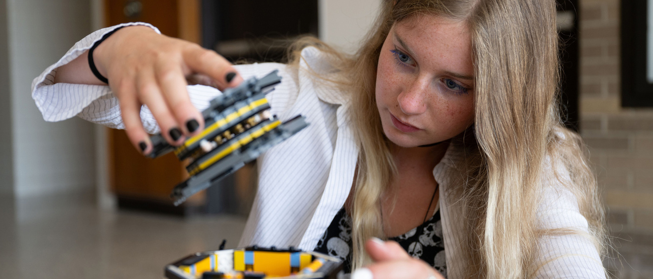 Ava Reed with TRACERS LEGO model