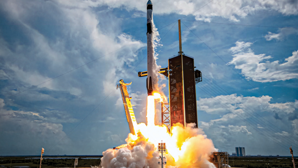 A photo of a SpaceX Falcon 9 rocket as it lifts off