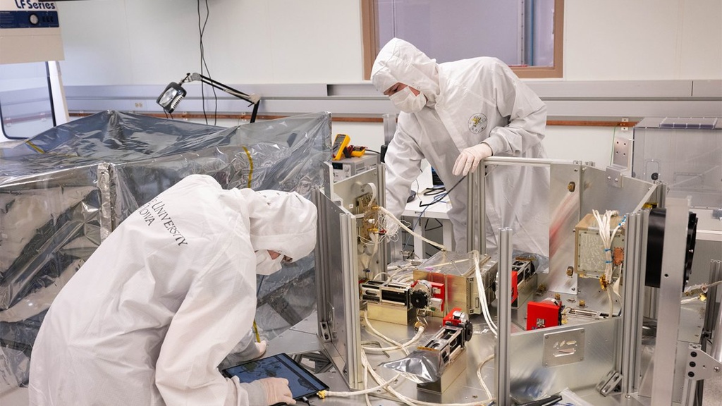 a photo of engineers working on TRACERS in a clean room at the University of Iowa